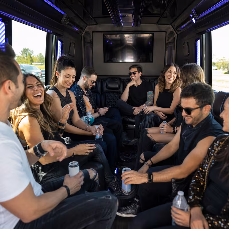 Passengers loading luggage while boarding an Parkland group shuttle