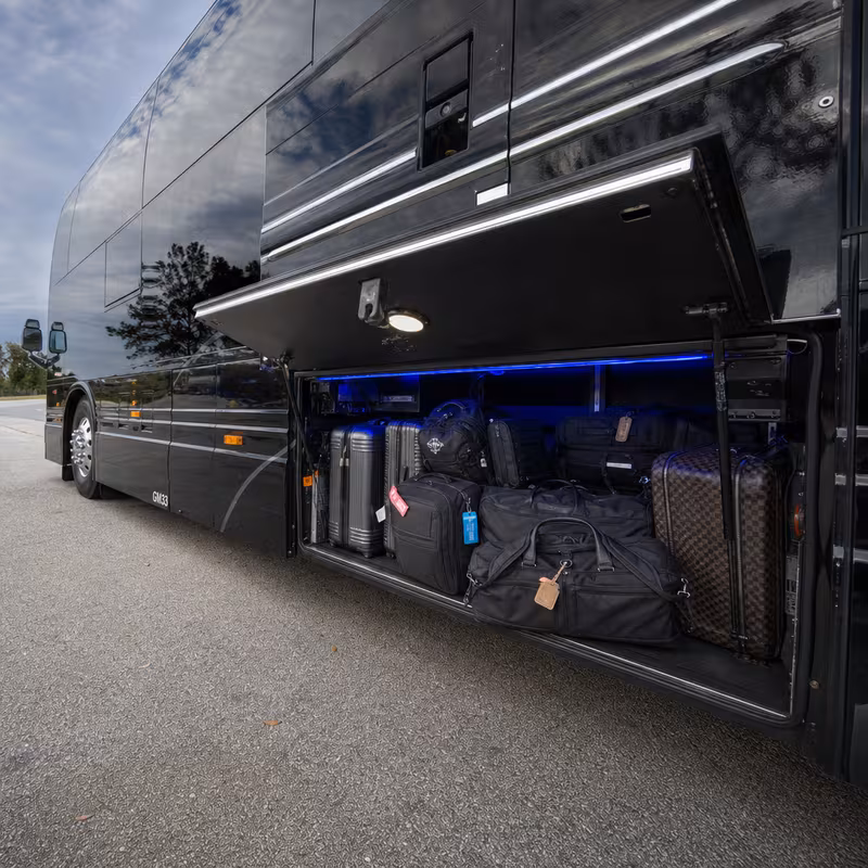 Party bus interior with wraparound leather seating and LED lighting in Parkland