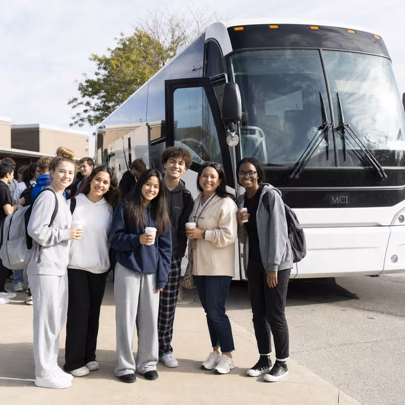 Passengers loading luggage while boarding an Parkland group shuttle