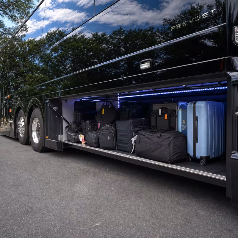Party bus interior with wraparound leather seating and LED lighting in Parkland