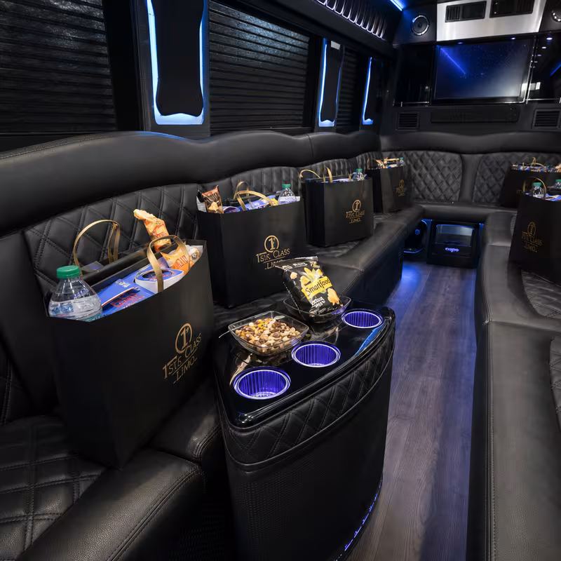 Party bus interior with wraparound leather seating and LED lighting in Parkland