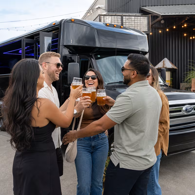 Passengers loading luggage while boarding an Parkland group shuttle